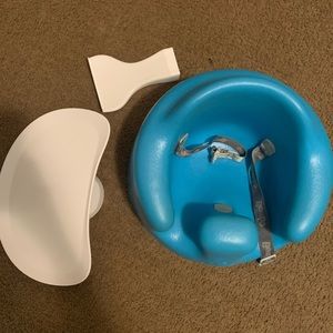 Blue bumbo seat with tray and tray stand